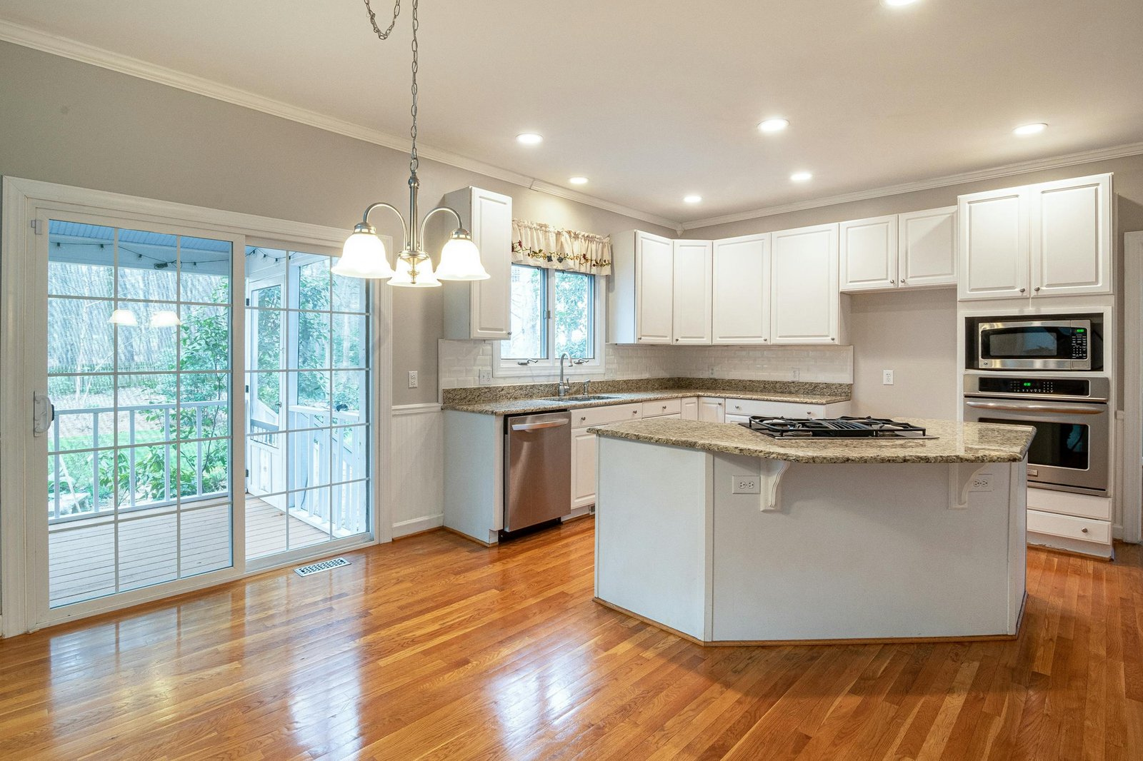 Ottawa white shaker kitchen after cabinet painting — BM Advance satin