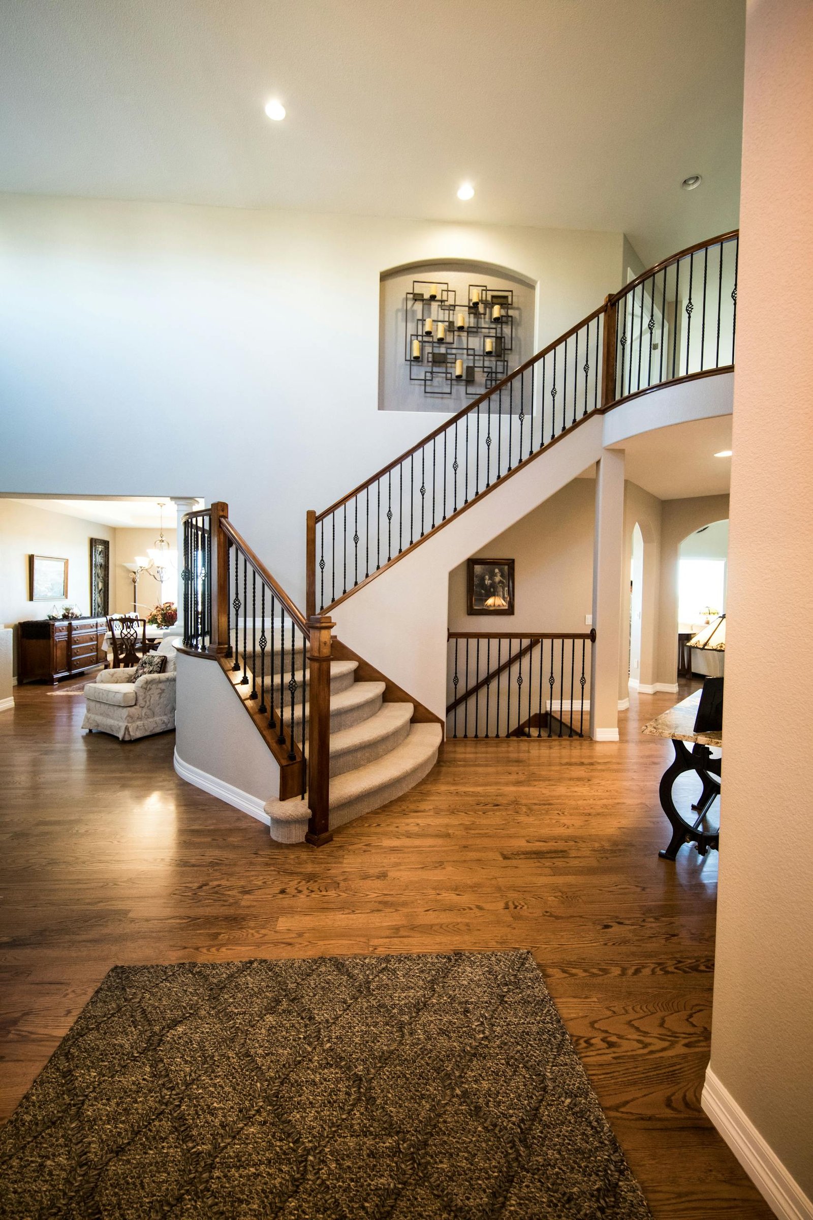 Ottawa staircase repainted — white spindles, stained rail
